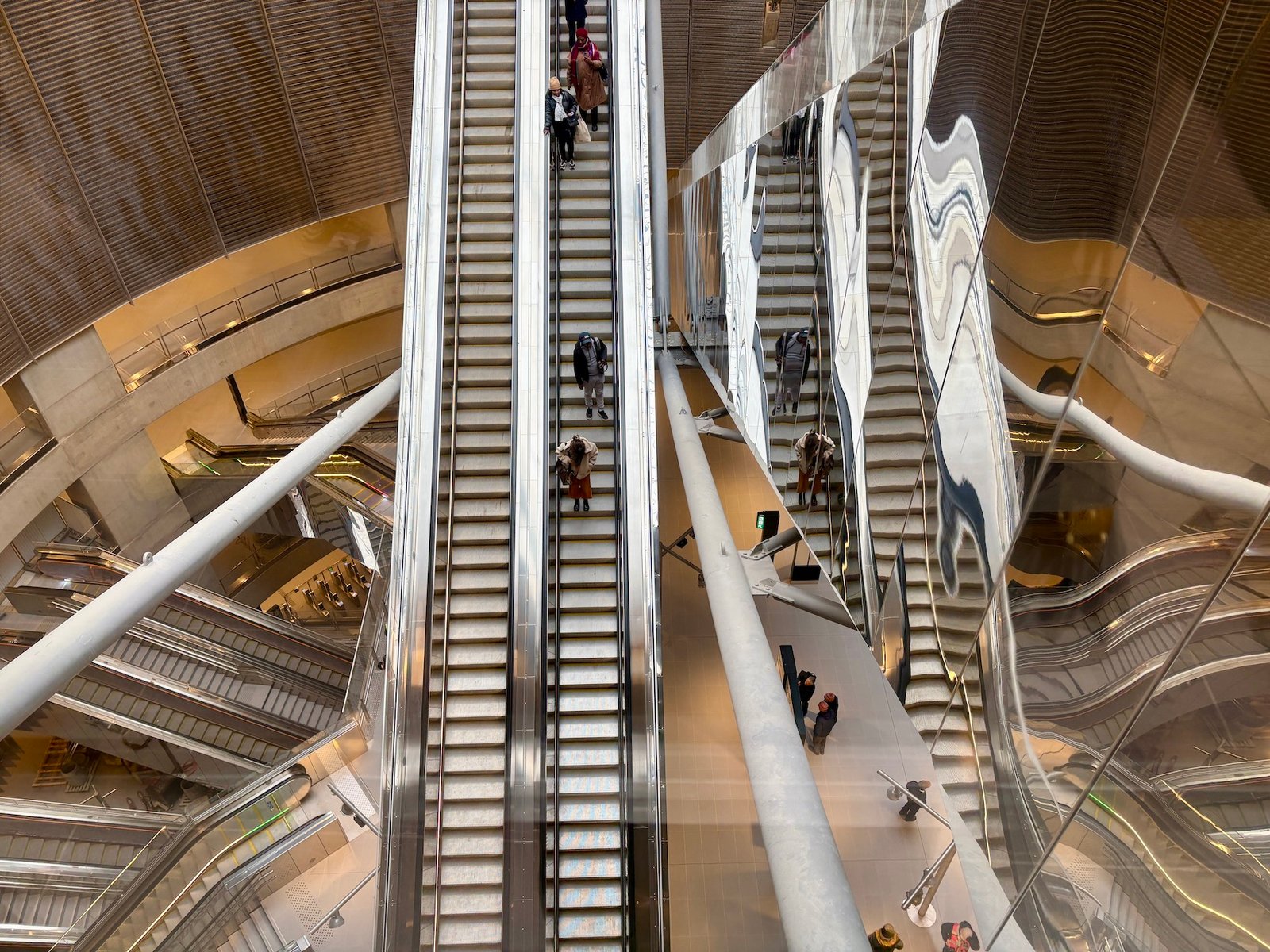 The long escalators inside the Villejuif - Gustave Roussy metro station.