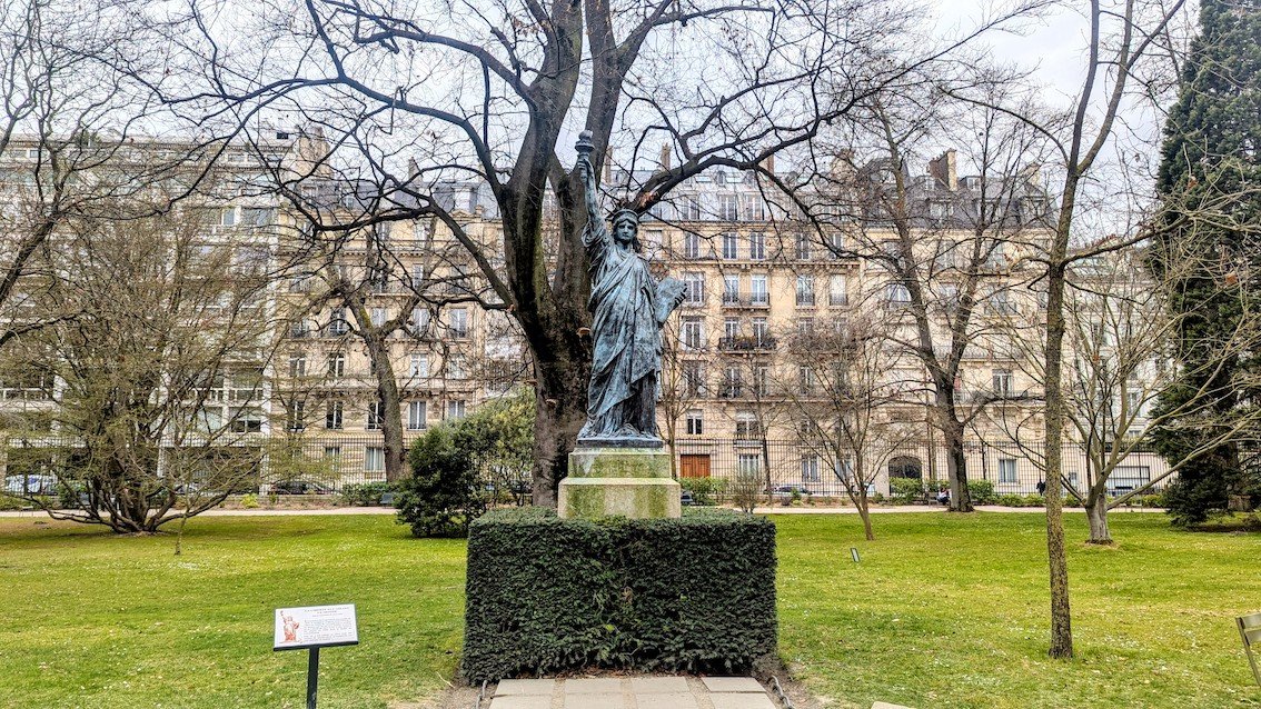 The bronze Statue of Liberty on the lawn of the Luxembourg Gardens in Paris.